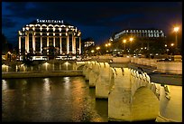 Pont Neuf and Samaritaine illuminated at night. Paris, France