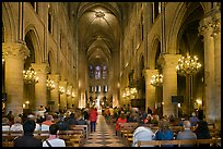 Interior of Notre-Dame de Paris during mass. Paris, France (color)