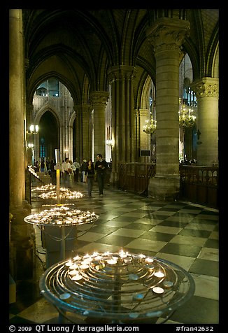 Candles in aisle, Notre-Dame-de-Paris. Paris, France (color)