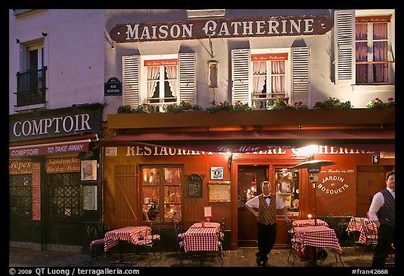 Restaurant and waiter at night, Montmartre. Paris, France (color)