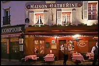 Restaurant and waiter at night, Montmartre. Paris, France ( color)