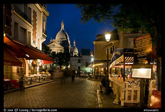 Place du Tertre at night with restaurants and Basilique du Sacre-Coeur, Montmartre. Paris, France (color)