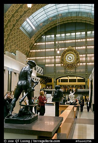 Sculpture and historic clock inside Orsay Museum. Paris, France