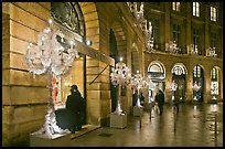 Looking at the storefronts of luxury stores at night, Place Vendome. Paris, France (color)