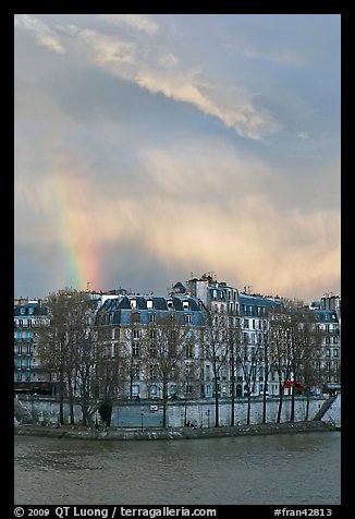 Riverfront houses on Ile Saint Louis with rainbow. Paris, France (color)