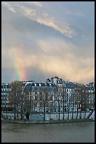 Riverfront houses on Ile Saint Louis with rainbow. Paris, France