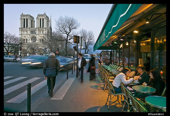 Cafe, street, and Notre Dame at dusk. Quartier Latin, Paris, France (color)