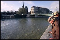 Fishermen on ile Saint Louis, with ile de la Cite in the background. Paris, France ( color)