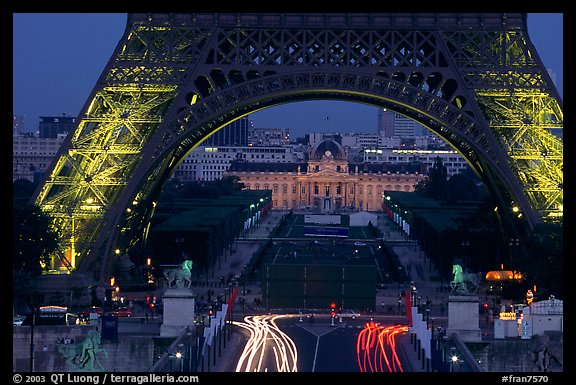 Ecole Militaire (Military Academy) seen through Tour Eiffel  at dusk. Paris, France