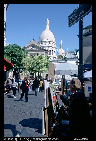 Painter on Place du Tertre, with the Sacre Coeur in the background, Montmartre. Paris, France (color)