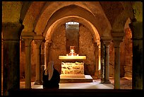 Crypte of the Romanesque church of Vezelay with Nun in prayer. Burgundy, France (color)