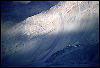 Monastary dwarfed by huge cliffs, Zanskar, Jammu and Kashmir. India (color)