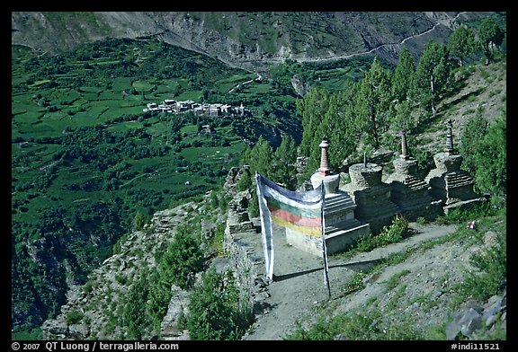 Prayer flag, chortens, and verdant valley below, Himachal Pradesh. India