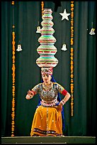 Rajasthani dancer balancing jars on head. New Delhi, India (color)
