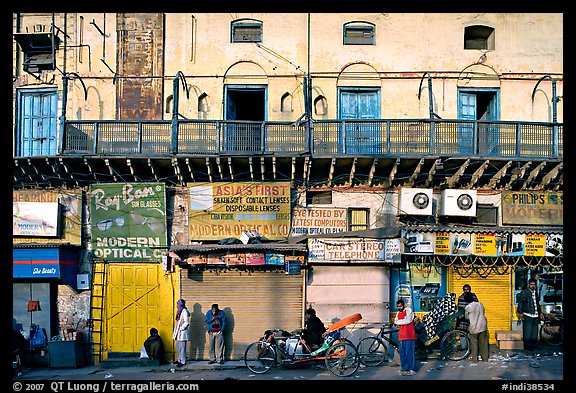 Street with old buildings and storefronts closed, Old Delhi. New Delhi, India (color)