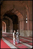 Two muslem men in Jama Masjid mosque prayer hall. New Delhi, India ( color)
