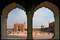 Courtyard of mosque seen through arches of prayer hall, Jama Masjid. New Delhi, India ( color)