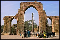 Iron pillar, and ruined mosque arch, Qutb complex. New Delhi, India (color)