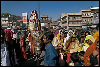 Wedding procession with flower-covered groom on horse. Jodhpur, Rajasthan, India