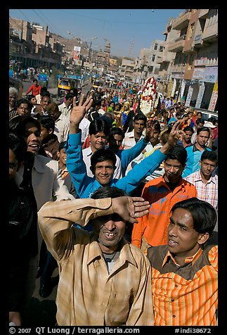 Young men walking in front of groom during a wedding procession. Jodhpur, Rajasthan, India (color)