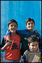 Young boys in front of blue wall. Jodhpur, Rajasthan, India ( color)