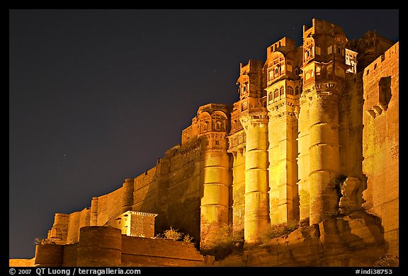 Towers and 36m high walls of Mehrangarh Fort by night. Jodhpur, Rajasthan, India (color)