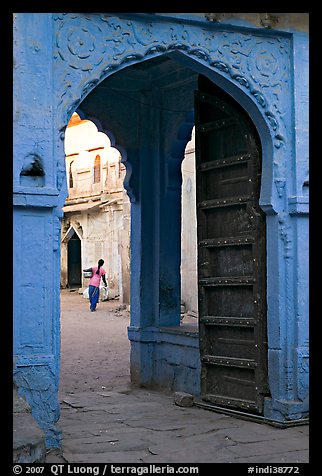 Archway with woman carrying water in courtyard. Jodhpur, Rajasthan, India (color)