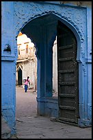 Archway with woman carrying water in courtyard. Jodhpur, Rajasthan, India ( color)