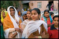 Women standing in the street during a wedding. Jodhpur, Rajasthan, India (color)