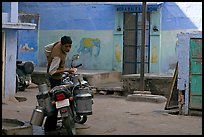 Man with milk delivery motorbike. Jodhpur, Rajasthan, India ( color)
