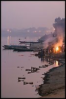 Cremation at Harishchandra Ghat at sunset. Varanasi, Uttar Pradesh, India (color)