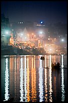 Lights reflected in the Ganga River at night. Varanasi, Uttar Pradesh, India ( color)