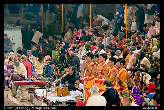 Brahmans standing amongst crowd at the begining of evening puja. Varanasi, Uttar Pradesh, India