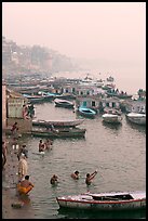 Pilgrims taking a holy dip in the Ganga River at dawn. Varanasi, Uttar Pradesh, India