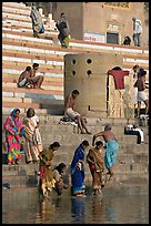 Women dipping feet in Ganga water at Sankatha Ghat. Varanasi, Uttar Pradesh, India (color)