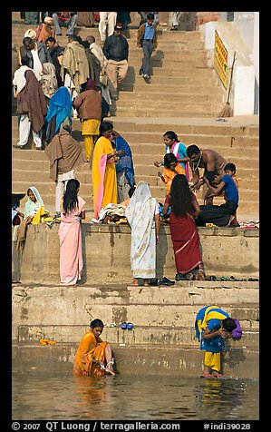Women rinsing in river Ganges water. Varanasi, Uttar Pradesh, India