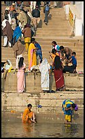 Women rinsing in river Ganges water. Varanasi, Uttar Pradesh, India ( color)