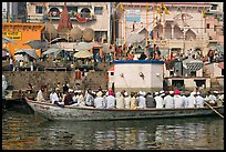 Boat packed with men near Dasaswamedh Ghat. Varanasi, Uttar Pradesh, India (color)