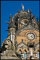 Lion and Gothic tower topped by 4m-high statue of Progress, Victoria Terminus. Mumbai, Maharashtra, India (color)