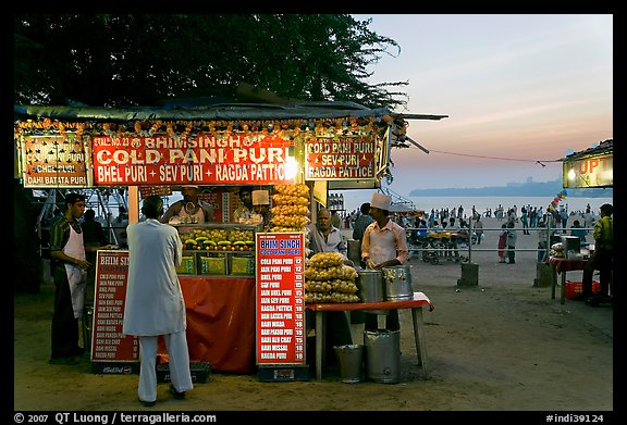 Food kiosks at sunset, Chowpatty Beach. Mumbai, Maharashtra, India