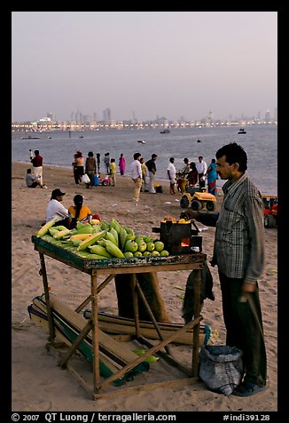 Food vendor on beach at dusk, Chowpatty Beach. Mumbai, Maharashtra, India (color)
