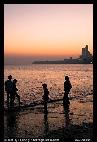 Beachgoers and skyline, Chowpatty Beach. Mumbai, Maharashtra, India