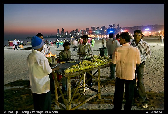 Stall broiling corn at night, Chowpatty Beach. Mumbai, Maharashtra, India (color)