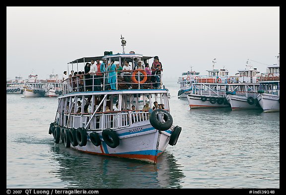 Tour boat loaded with passengers. Mumbai, Maharashtra, India (color)