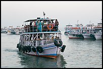 Tour boat loaded with passengers. Mumbai, Maharashtra, India ( color)