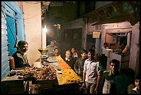 Street with vendor of sweets by night, Taj Ganj. Agra, Uttar Pradesh, India ( color)