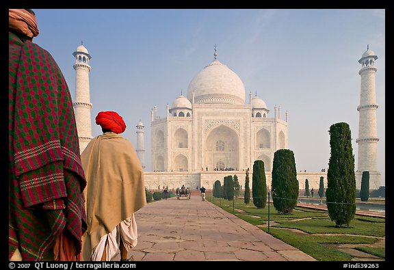 Men with turbans walking toward Taj Mahal, early morning. Agra, Uttar Pradesh, India