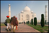 Men walking toward Taj Mahal, early morning. Agra, Uttar Pradesh, India