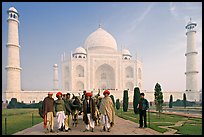 Men with turbans and cows in front of Taj Mahal, early morning. Agra, Uttar Pradesh, India (color)