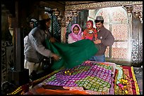 Family making offering inside Shaikh Salim Chishti mausoleum. Fatehpur Sikri, Uttar Pradesh, India ( color)